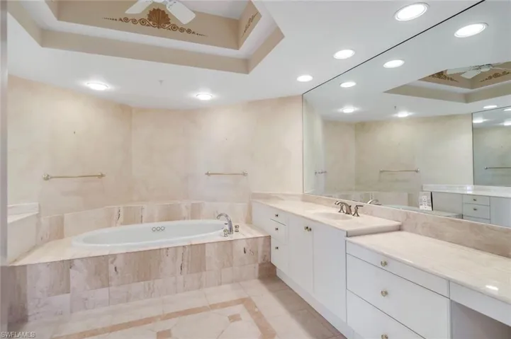 Spacious primary Suite bath area w/Jacuzzi. Oversized walk-in closet!