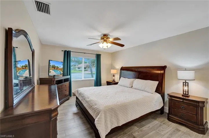 Bedroom featuring light wood-style flooring and a ceiling fan