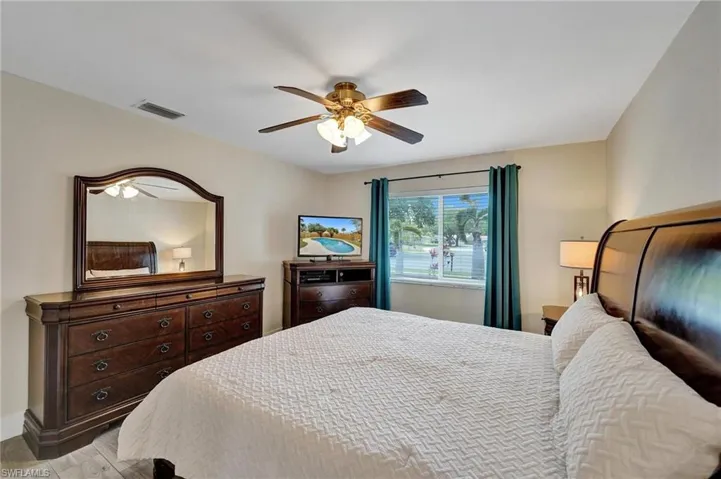Bedroom featuring a ceiling fan and light wood-style floors