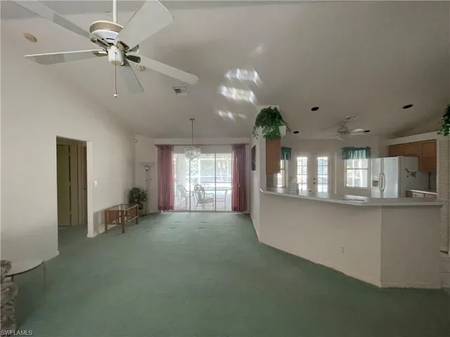 Sliding glass door at back with view of the pool.