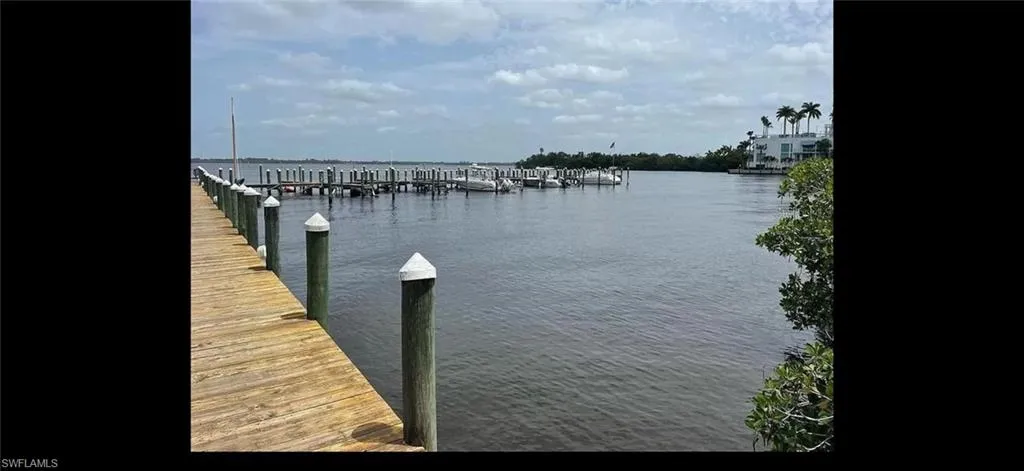 Dock featuring a water view