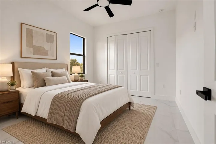 White walls, recessed lighting, and a black ceiling fan