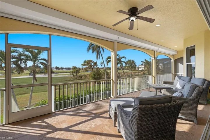 Sunroom featuring plenty of natural light and ceiling fan