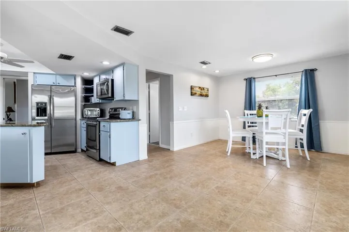 Kitchen overlooks family room and dining area