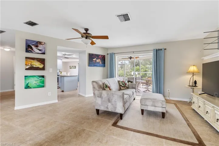 Living area open to lanai and kitchen
