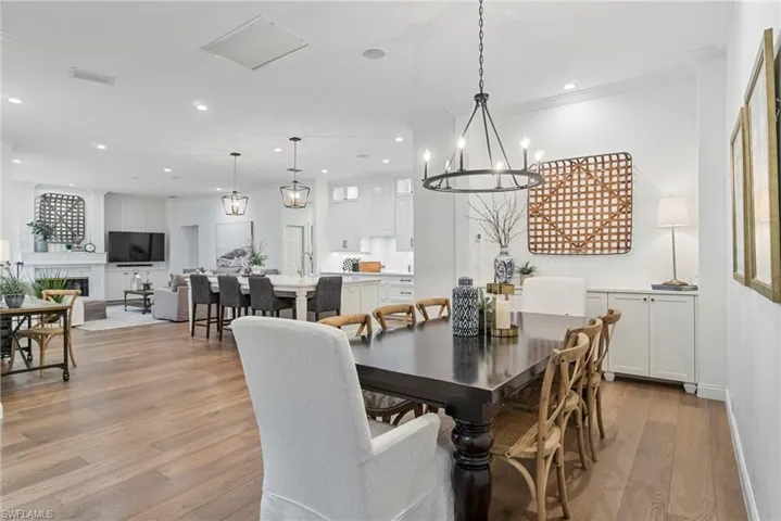 Large, open dining area with serving counter and built in cabinets for extra storage