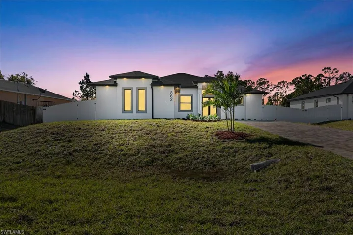 View of front of home with stucco siding