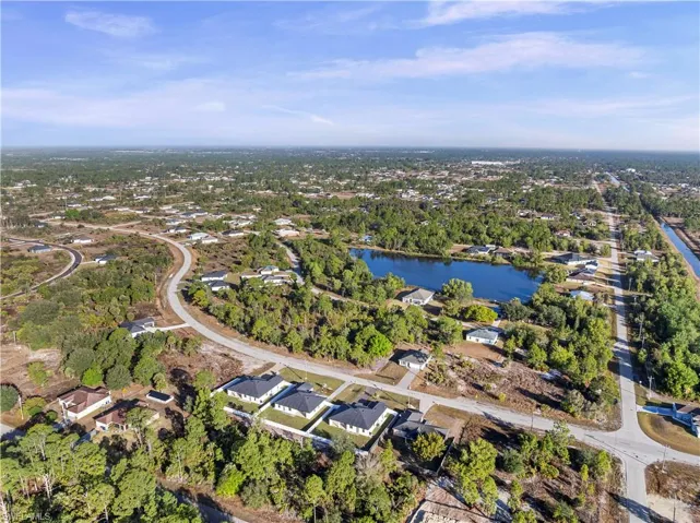 View of property location featuring nearby suburban area and a large body of water