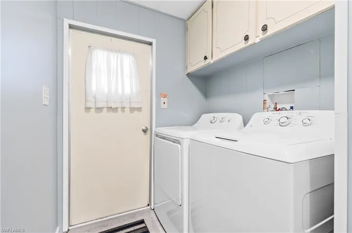 Laundry area with washing machine and dryer and cabinet space