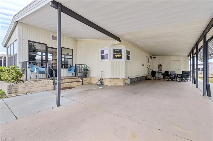 View of patio featuring a carport