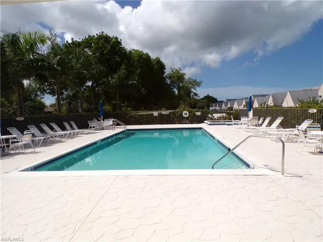 Community pool featuring a patio area