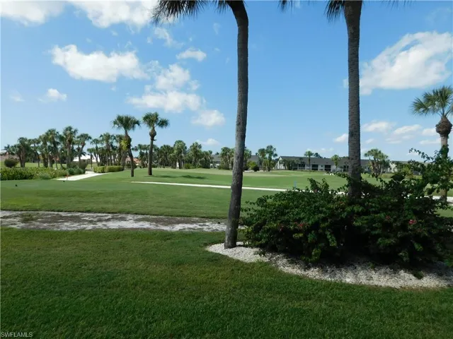 Surrounding community featuring view of golf course