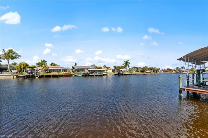 Dock featuring a water view and a residential view