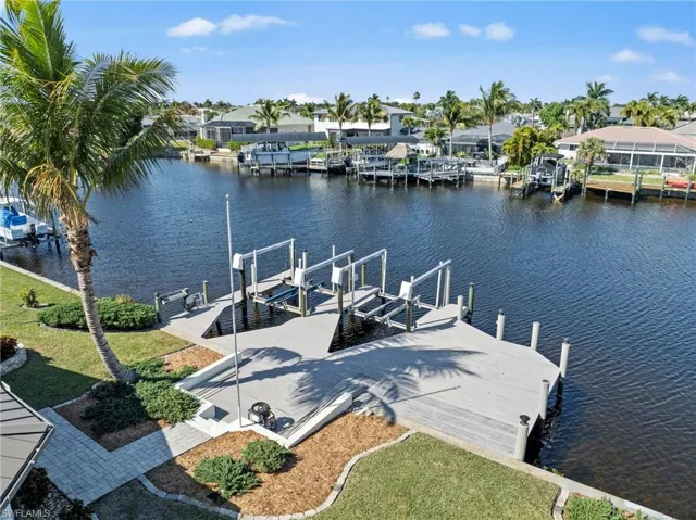Dock area with a water view and boat lift