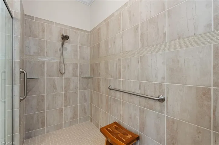 Bathroom with a shower with shower door