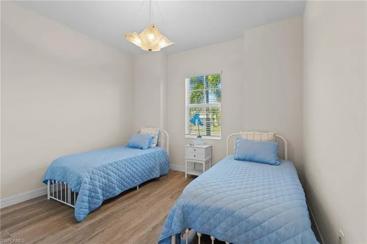 Bedroom with wood-type flooring