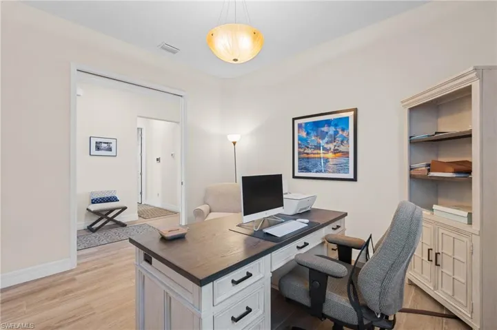 Office space with light wood-type flooring