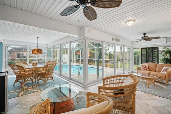 Sunroom / solarium featuring plenty of natural light and a ceiling fan