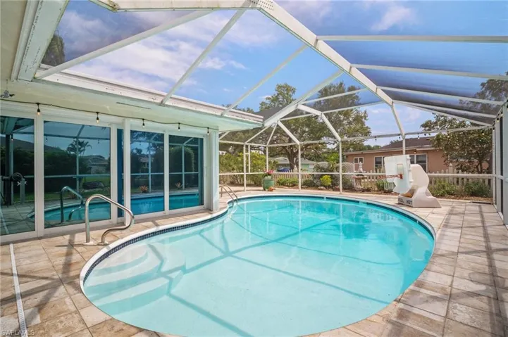Pool with a lanai and a patio
