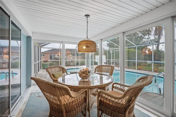 Sunroom / solarium featuring a pool