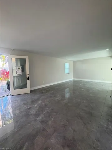 Unfurnished room with baseboards