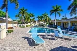 Community pool with a patio area