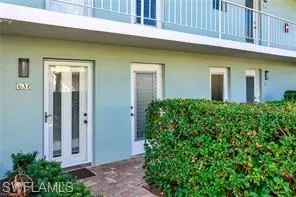 Property entrance featuring stucco siding