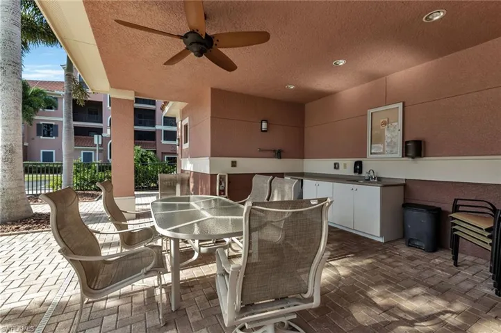 View of patio / terrace featuring ceiling fan and sink