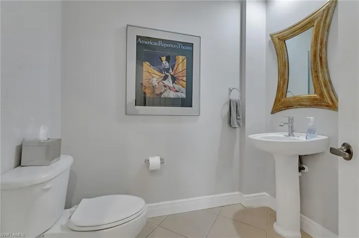 Bathroom with toilet and tile patterned floors