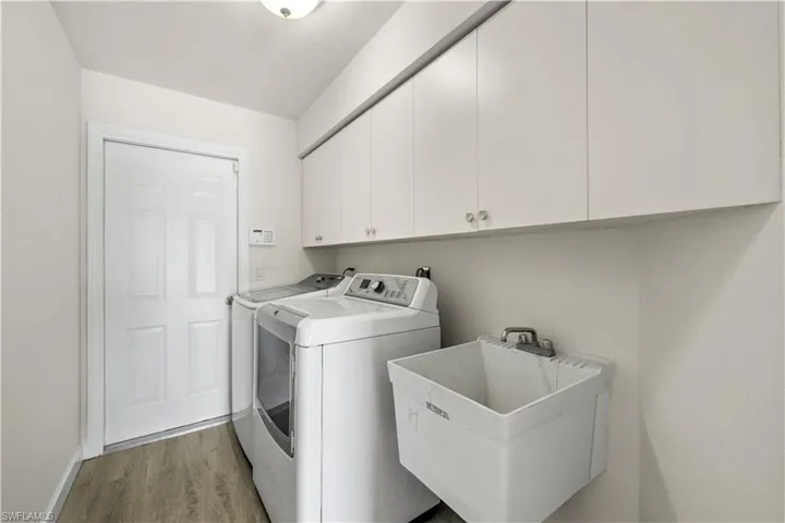 Laundry Room with Cabinets and Utility Sink