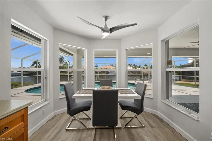 Dining space featuring a wealth of natural light and a water view