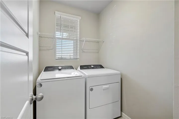 Laundry room featuring separate washer and dryer