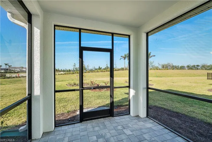 Unfurnished sunroom with a wealth of natural light and a rural view