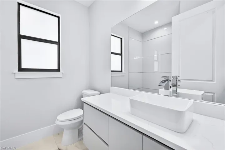 Full bath with toilet and vanity