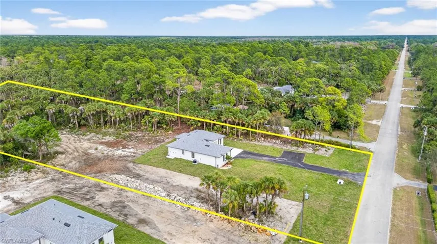 View of property location with property parcel outlined and a forest