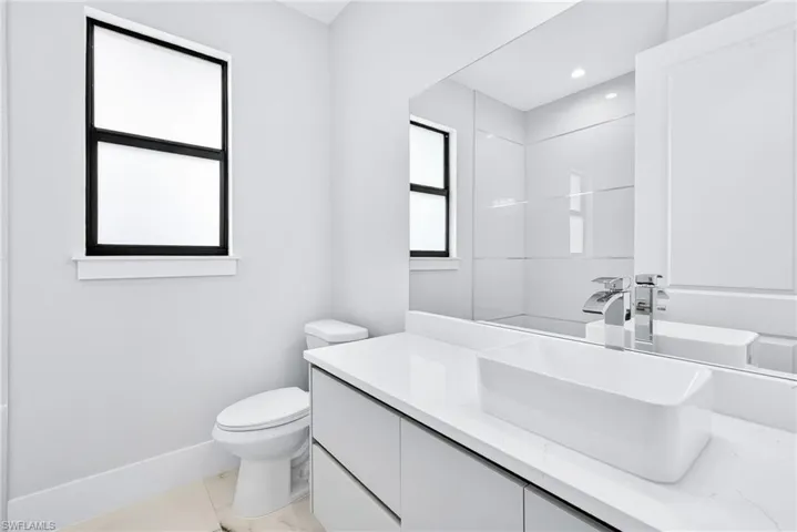 Full bathroom featuring vanity and toilet