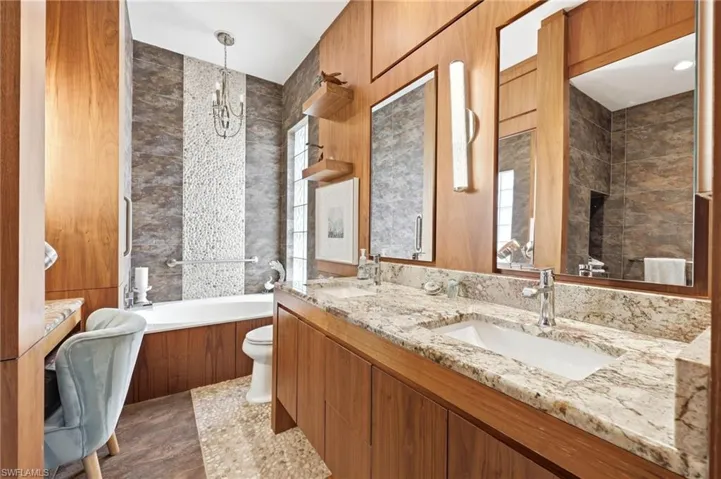 Absolutley stunning remodeled Master Bathroom with the same custom European Craftsmanship Wood Cabintes and Granite Countertops