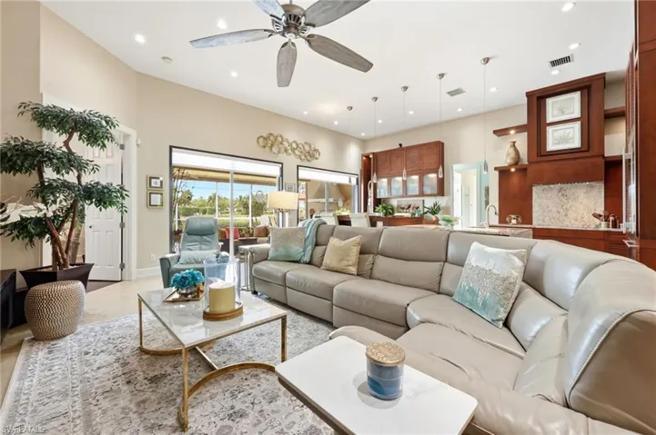 Living Room with access to outdoor Patio and French Doors to Master Bedroom