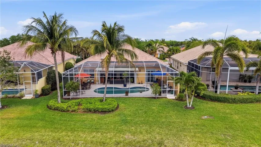 Fully screened-in Lanai with a privacy wall on the right.
