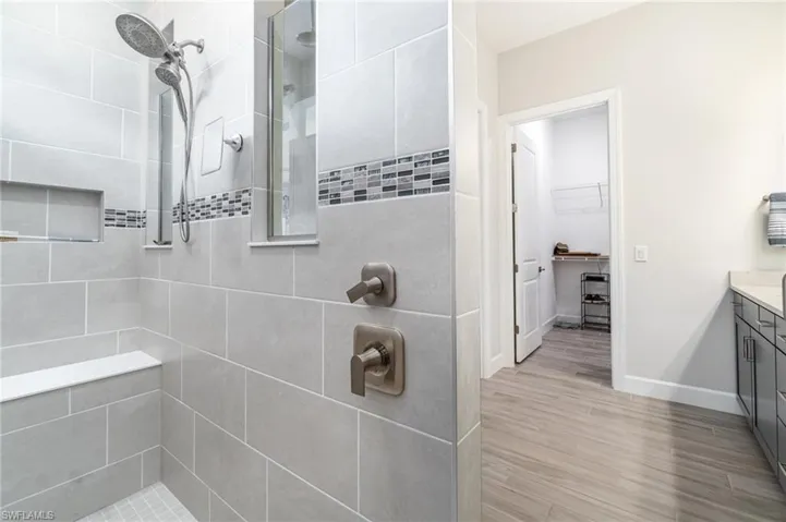 Large walk-in shower with spa like features.