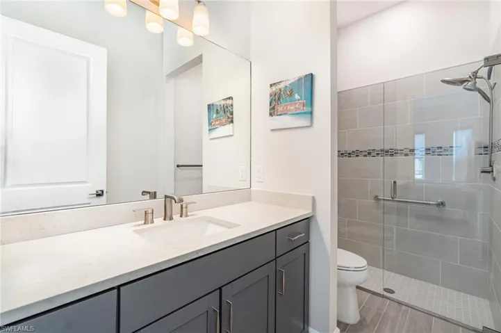 Guest Bedroom ensuite with walk in shower.
