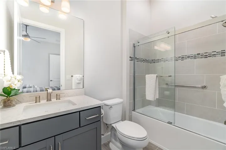 Guest Bedroom ensuite with tub/shower combination and upgraded glass shower doors.