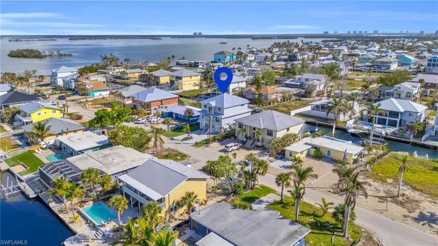 VIRTUALLY ENHANCED - Birds eye view of property with a water view