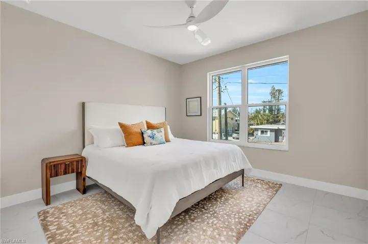 Bedroom with ceiling fan /  virtually enhanced photo