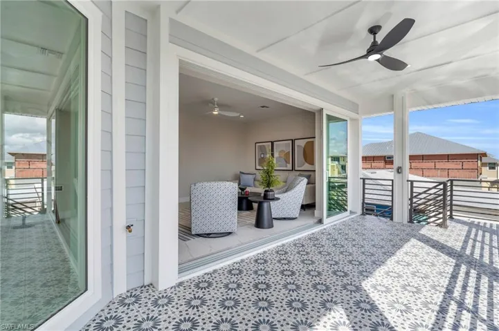 View of patio featuring ceiling fan /  virtually enhanced photo