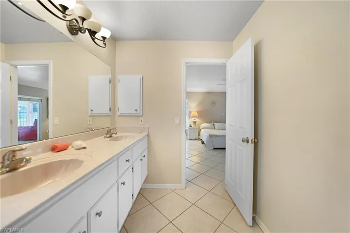 Bathroom with vanity and tile patterned floors