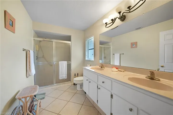 Bedroom 2, Unfurnished room featuring light tile patterned floors and ceiling fan
