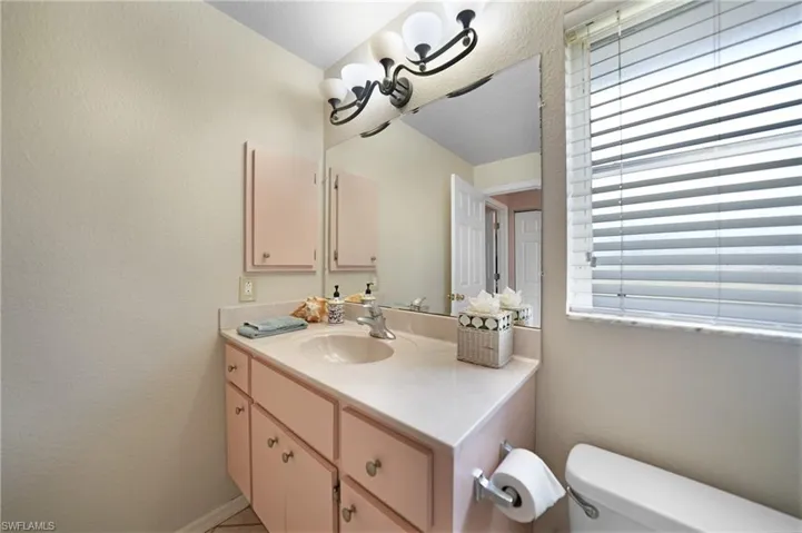 Bathroom 2 featuring toilet and vanity
