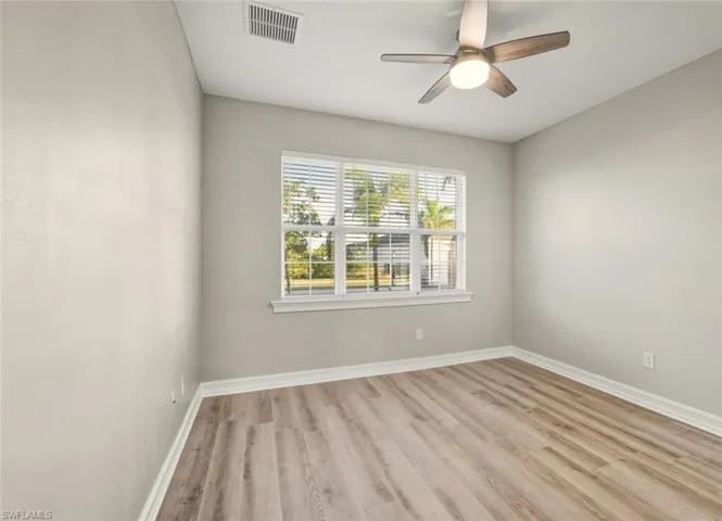 Spare room with light wood-style flooring and ceiling fan