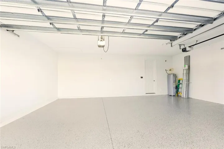Garage featuring electric water heater